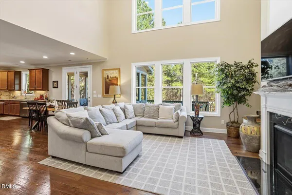 a living room with fireplace furniture and a flat screen tv
