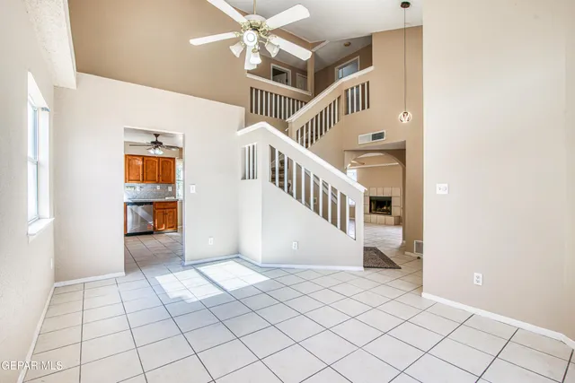 a kitchen with a stove a sink and a counter top space
