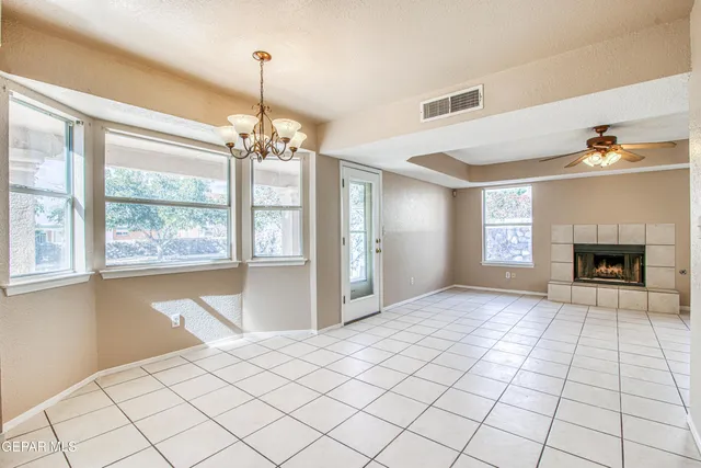 a bathroom with a granite countertop toilet sink and mirror