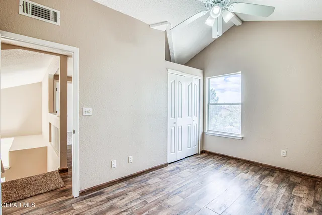 a view of yard with yellow lighting