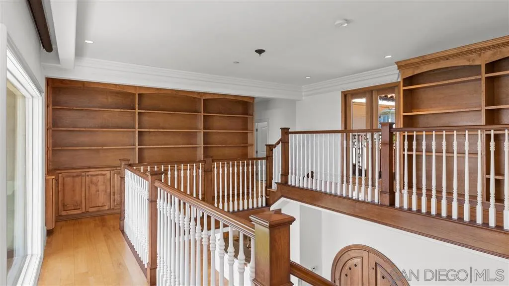 5730 Dolphin Place La Jolla, CA 92037 - Photo 11 of 19 a view of a hallway with wooden floor and entryway