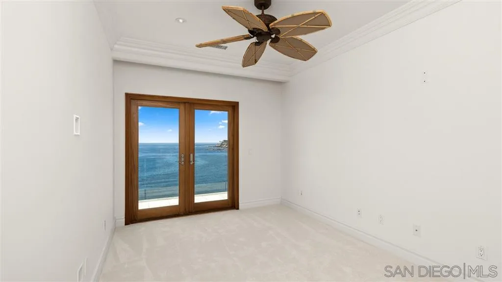 5730 Dolphin Place La Jolla, CA 92037 - Photo 12 of 19 an empty room with a window and a fan