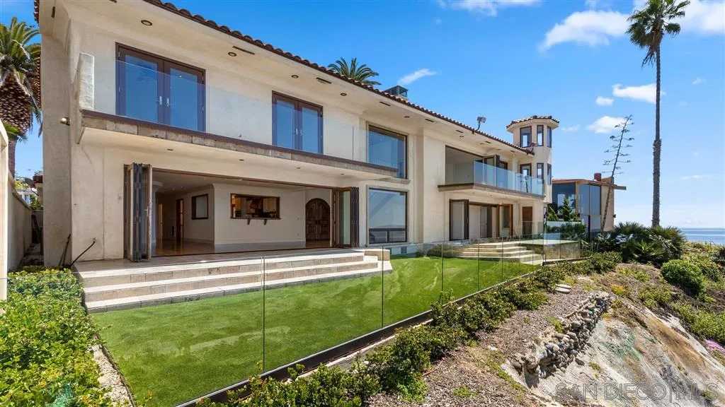 5730 Dolphin Place La Jolla, CA 92037 - Photo 18 of 19 a view of a house with a yard and plants