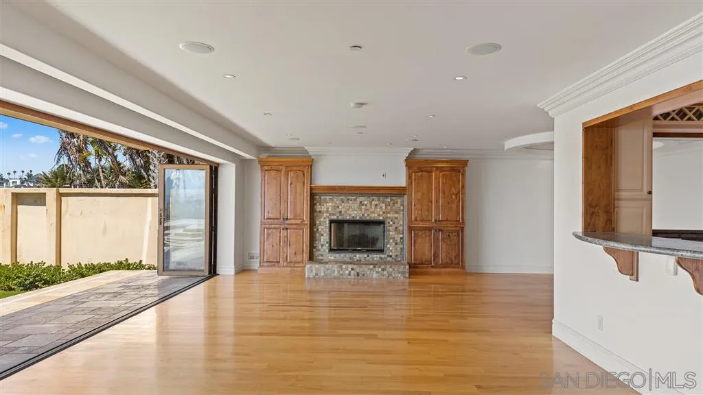5730 Dolphin Place La Jolla, CA 92037 - Photo 3 of 19 a view of a livingroom with a fireplace window and front door