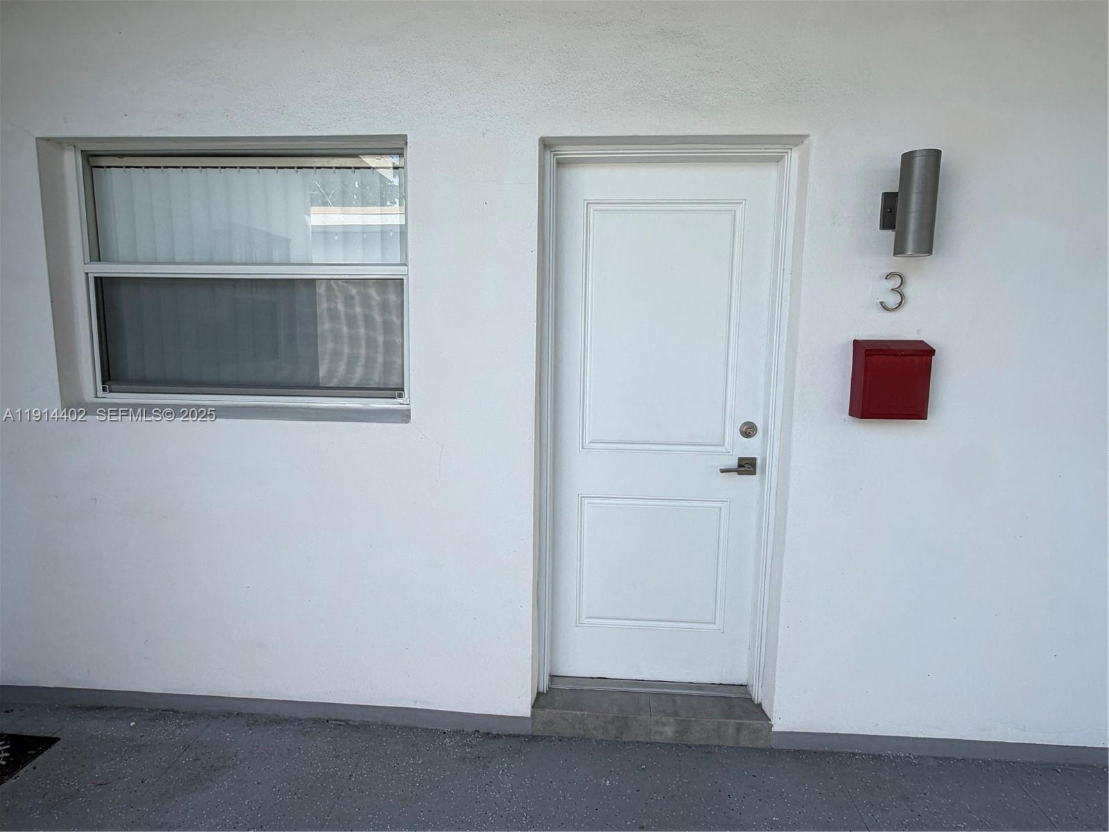 3051 Southwest 27th Lane, Unit 3 Miami, FL 33133 - Photo 2 of 8 a view of an empty room with a window
