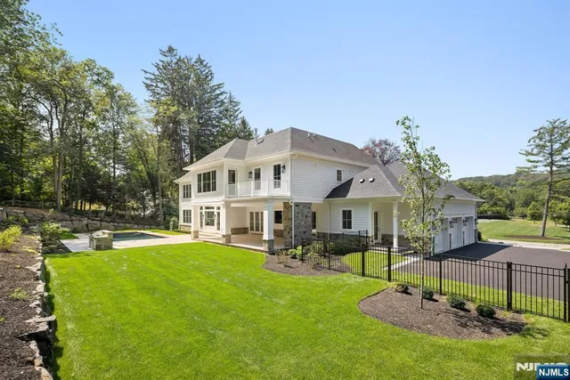 a front view of a house with a yard table and chairs