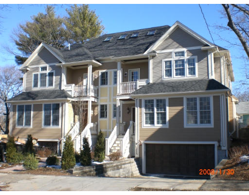 60 Withington Road, Unit 1 Newton, MA 02460 - Photo 1 of 2 a front view of a house with a yard
