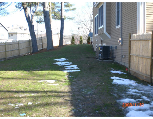 60 Withington Road, Unit 1 Newton, MA 02460 - Photo 2 of 2 a backyard of a house with lots of green space