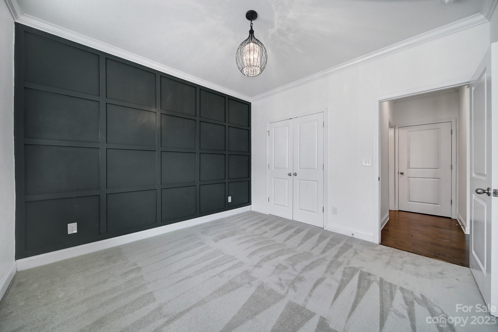 5072 Gribble Lane Lancaster, SC 29720 - Photo 15 of 34 a bedroom with a bed and a chandelier