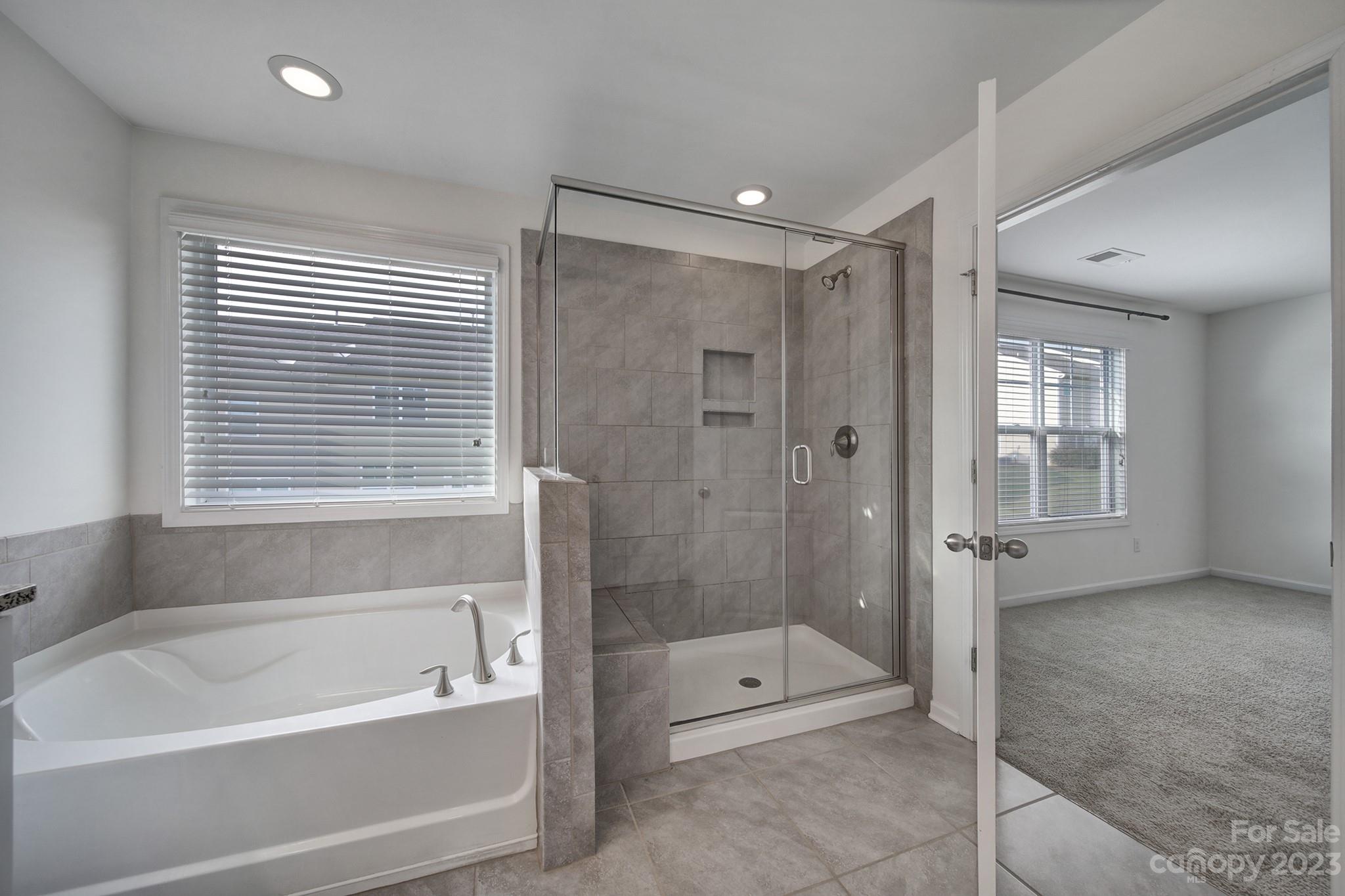 5072 Gribble Lane Lancaster, SC 29720 - Photo 27 of 34 a bathroom with a tub shower and a sink