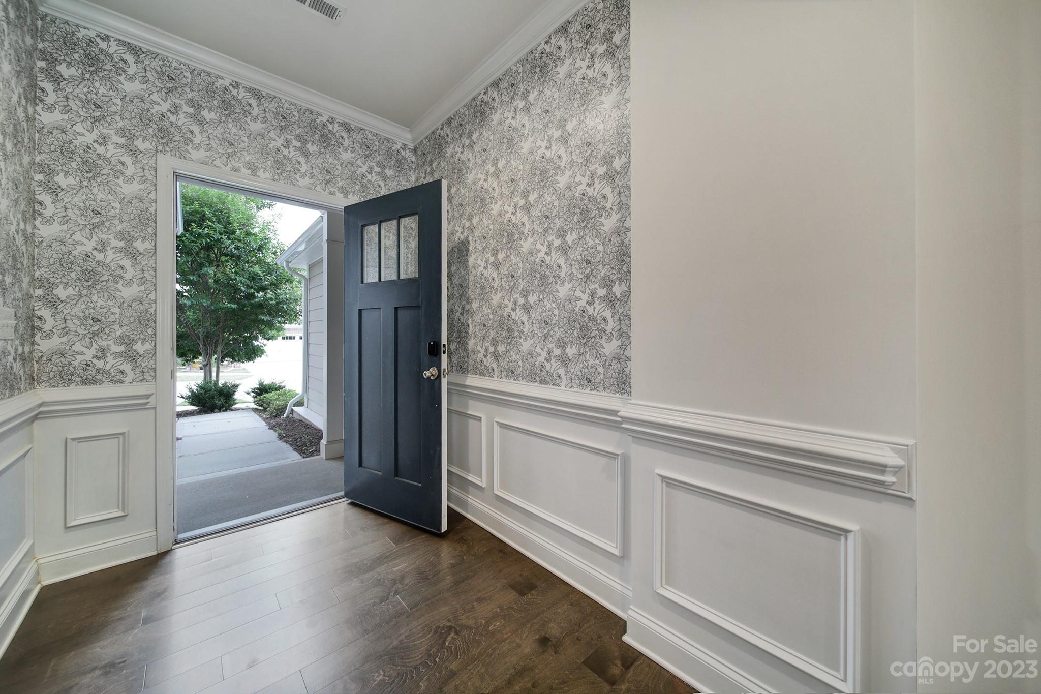 5072 Gribble Lane Lancaster, SC 29720 - Photo 3 of 34 a hallway with white cabinets and wooden floor