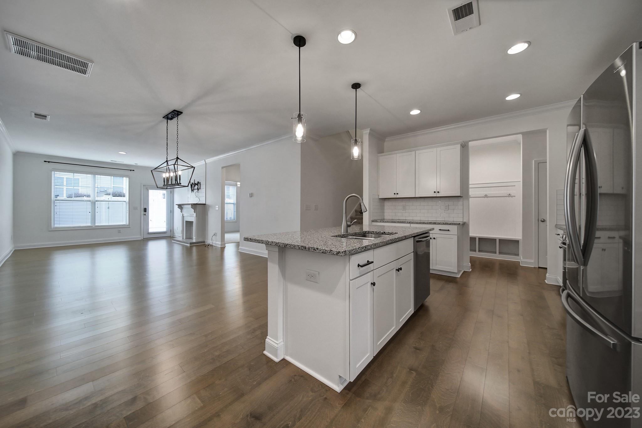 5072 Gribble Lane Lancaster, SC 29720 - Photo 4 of 34 a large kitchen with granite countertop a large counter top a sink stainless steel appliances and cabinets