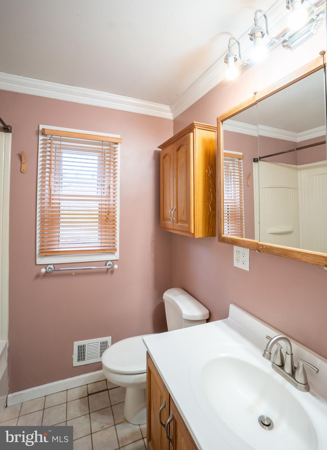 32 Coleridge Avenue Hamilton, NJ 08620 - Photo 12 of 22 a bathroom with a sink a toilet and mirror
