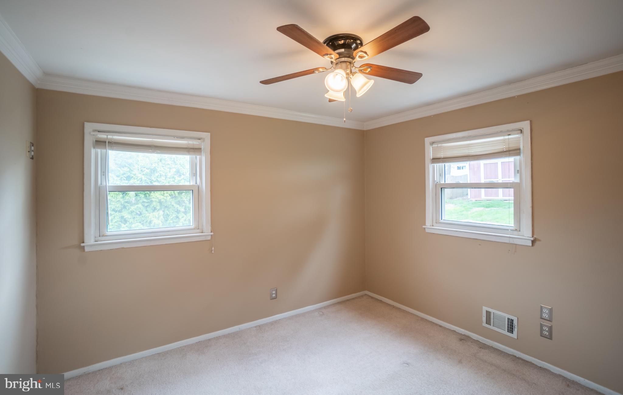 32 Coleridge Avenue Hamilton, NJ 08620 - Photo 13 of 22 an empty room with windows and fan