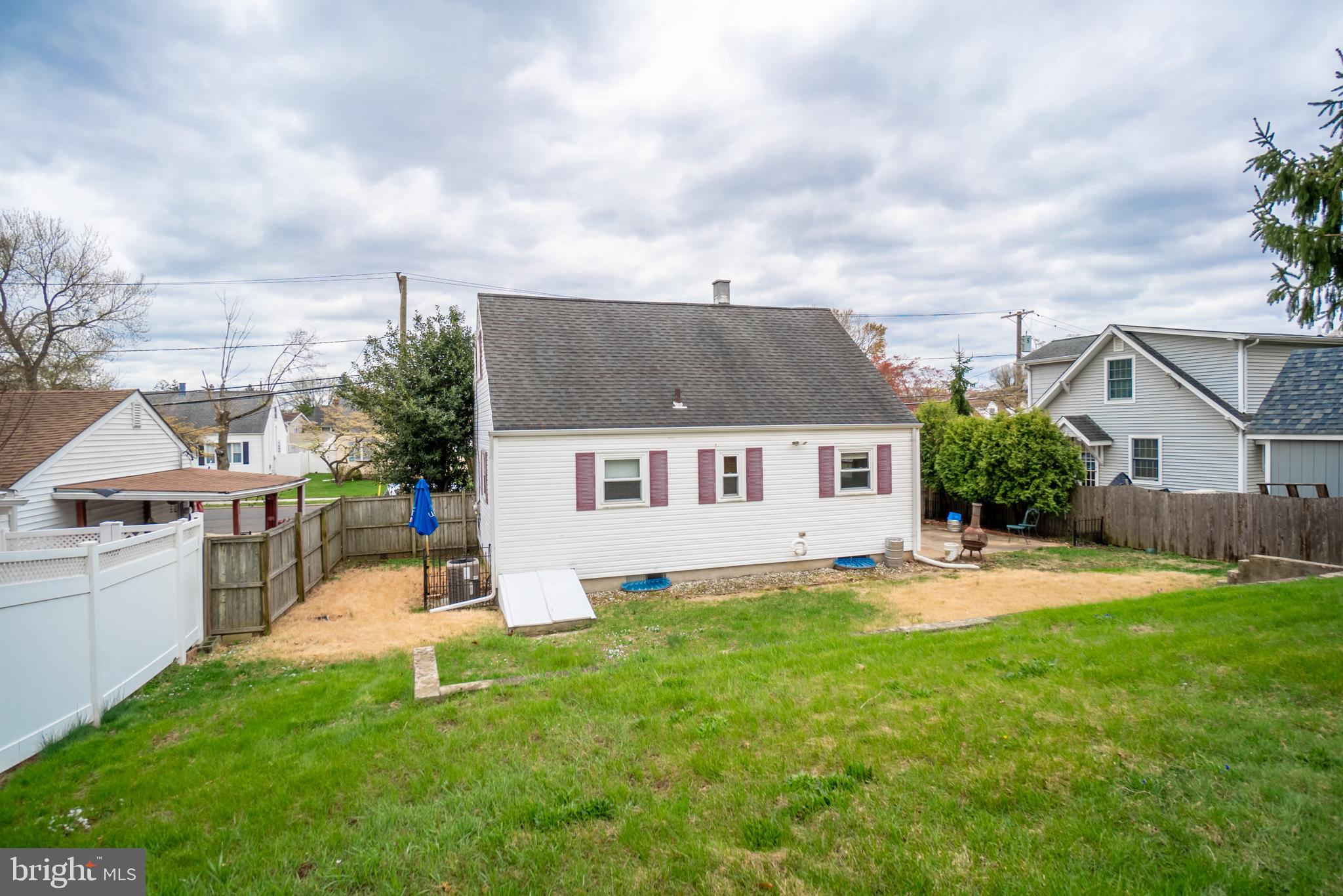 32 Coleridge Avenue Hamilton, NJ 08620 - Photo 21 of 22 a front view of house with yard and trees in the background