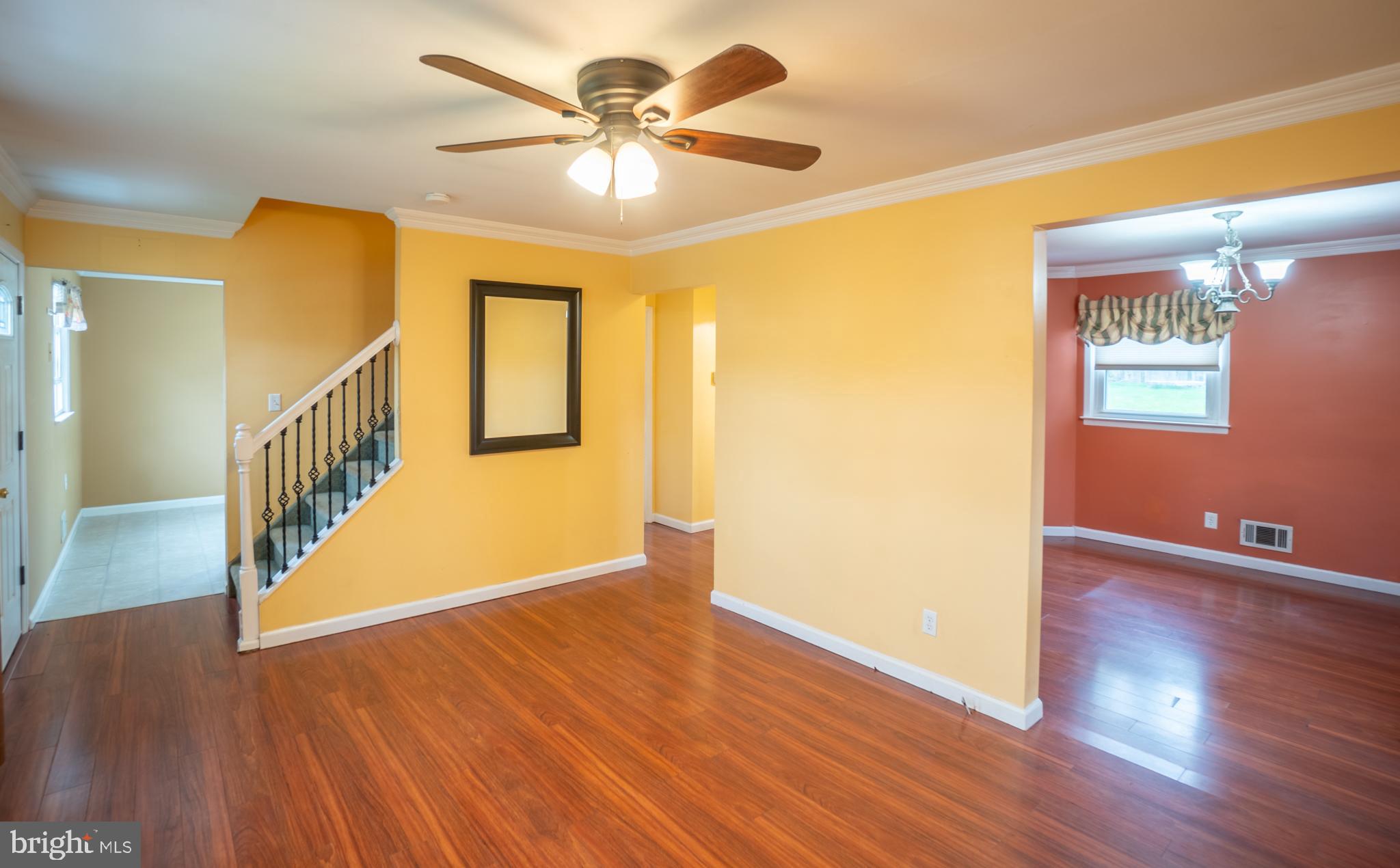 32 Coleridge Avenue Hamilton, NJ 08620 - Photo 3 of 22 a view of an empty room with wooden floor and a ceiling fan