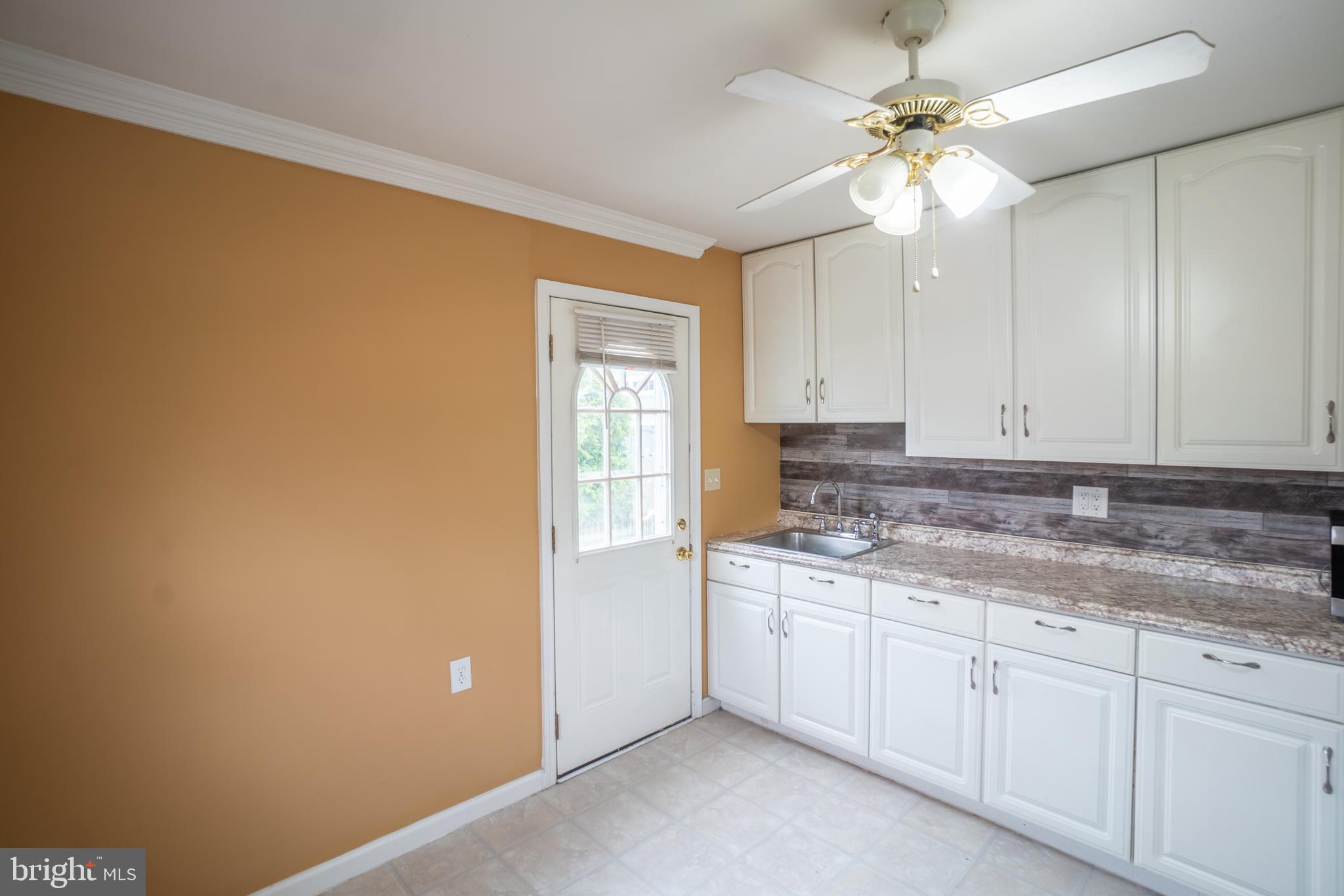 32 Coleridge Avenue Hamilton, NJ 08620 - Photo 7 of 22 a kitchen with a sink cabinets and window