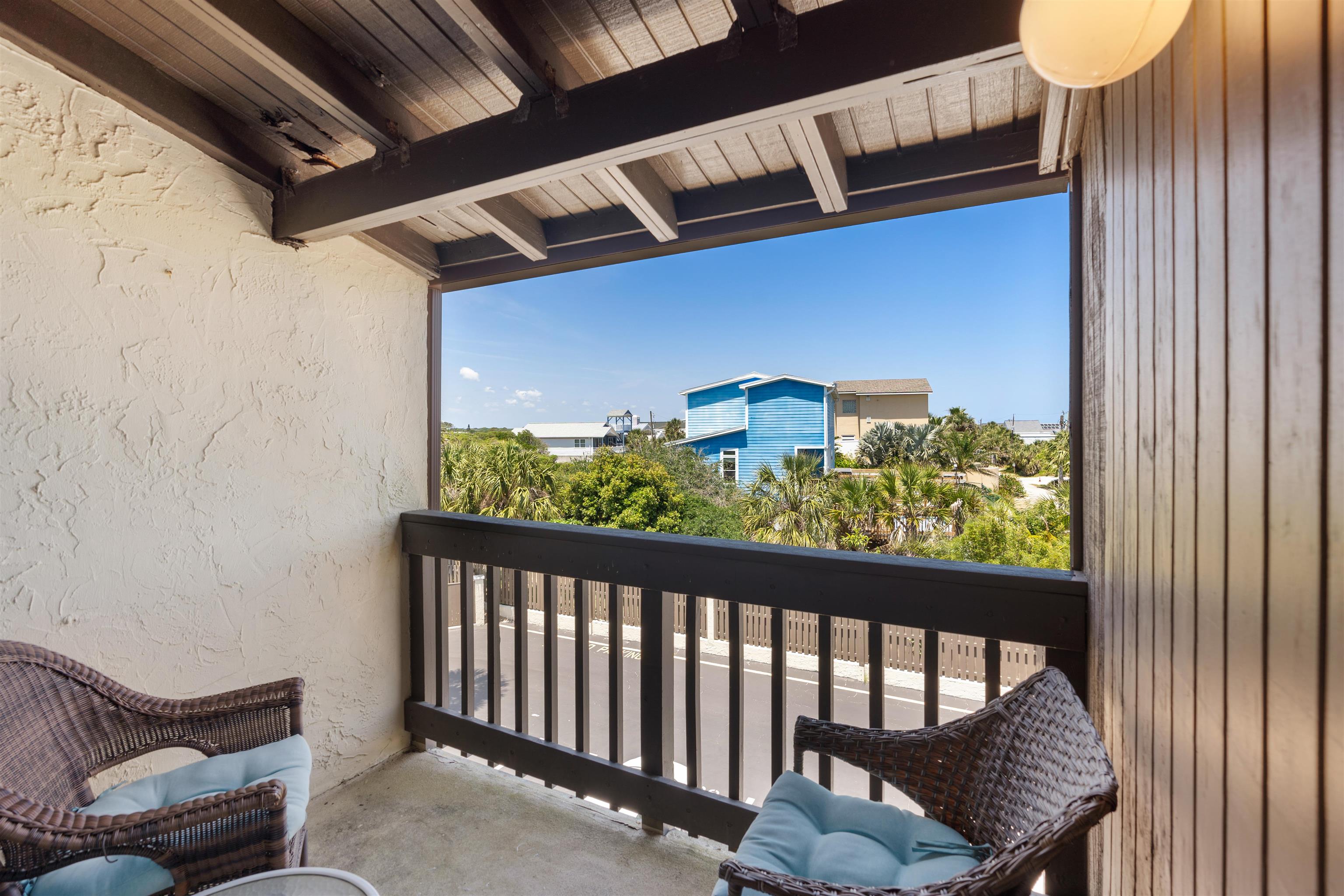 5650 A1A South, Unit C218 St. Augustine, FL 32080 - Photo 27 of 77 a view of a balcony with furniture