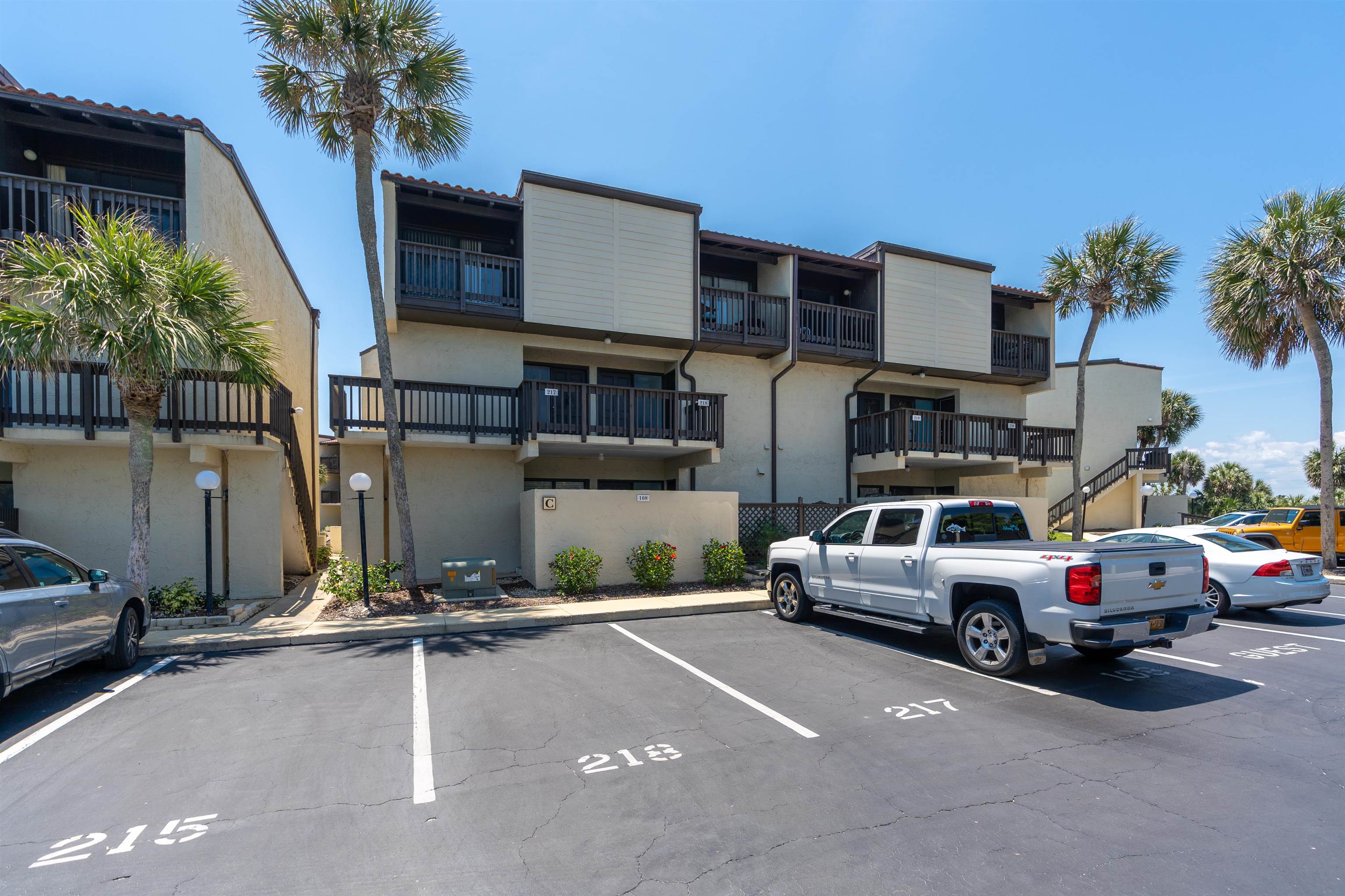 5650 A1A South, Unit C218 St. Augustine, FL 32080 - Photo 4 of 77 a car parked in front of a building
