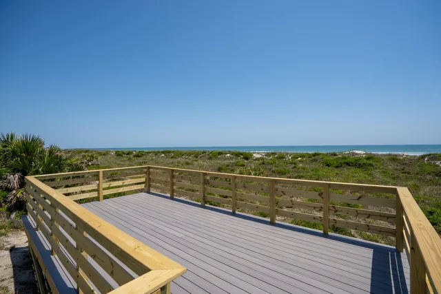 a view of balcony with yard