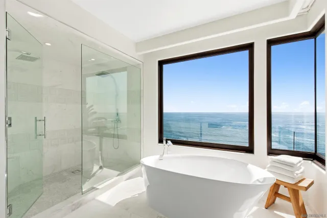 a bedroom with bed and a flat screen tv