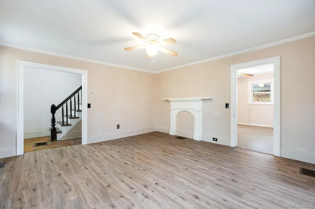 a view of livingroom with furniture wooden floor and a window