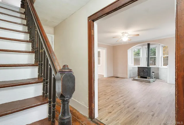 a view of a livingroom with furniture and staircase
