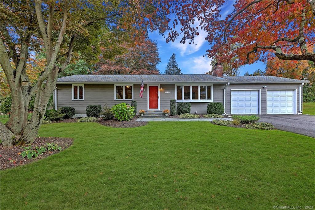 302 Woodruff Road Milford, CT 06461 - Photo 1 of 1 a front view of house with yard and green space