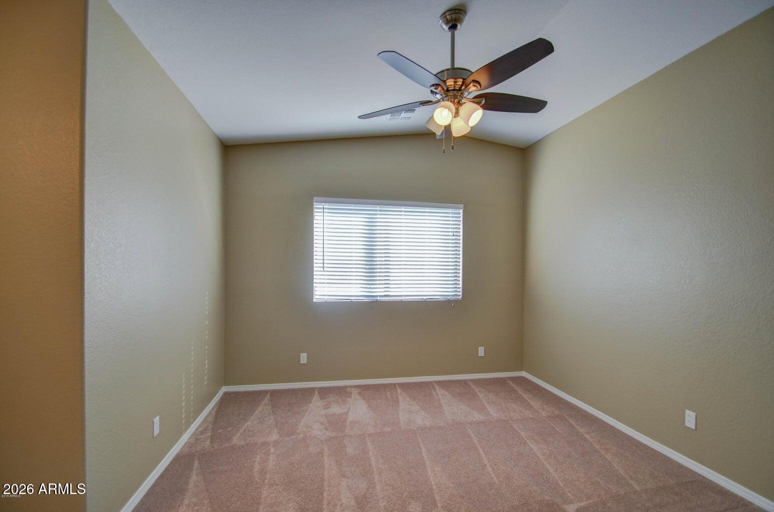 3022 North 34th Place Phoenix, AZ 85018 - Photo 25 of 40 an empty room with a window and a fan