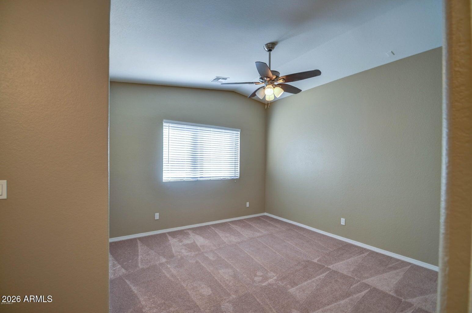 3022 North 34th Place Phoenix, AZ 85018 - Photo 26 of 40 an empty room with a ceiling fan and a window