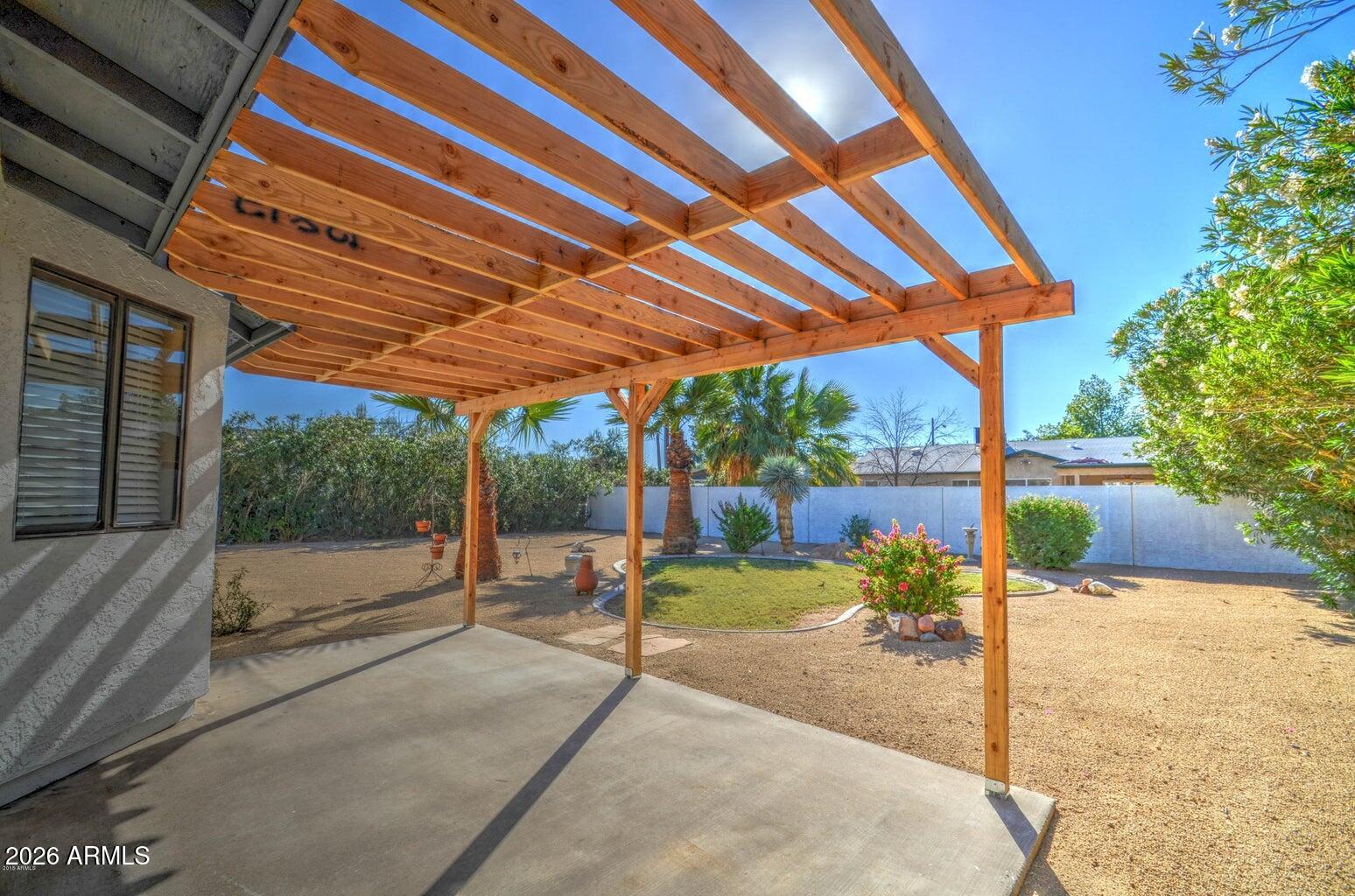 3022 North 34th Place Phoenix, AZ 85018 - Photo 34 of 40 a patio with a yard