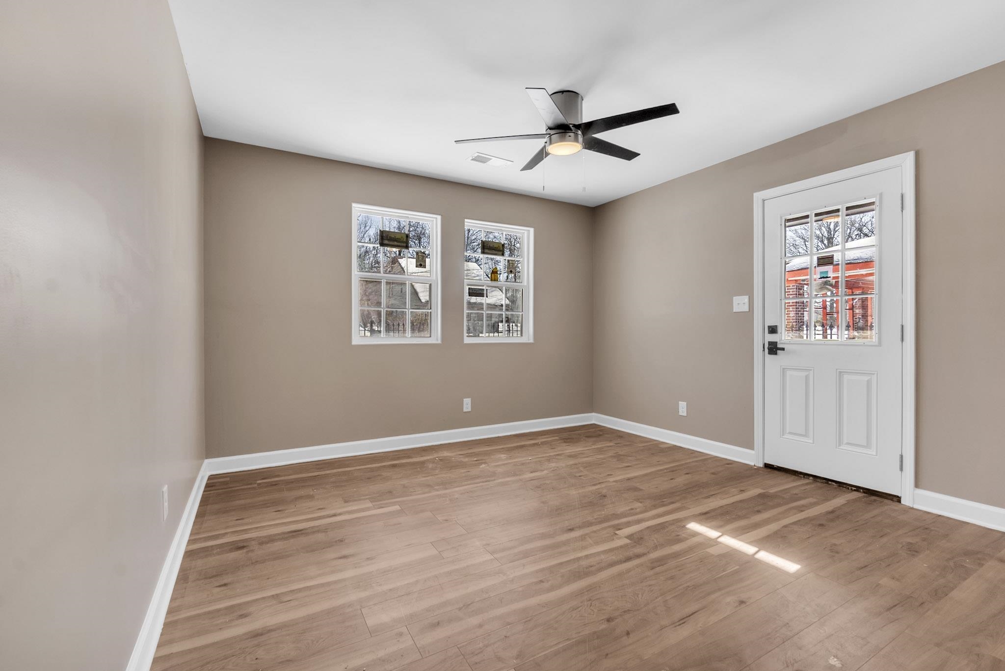 375 Pope Street Memphis, TN 38112 - Photo 4 of 19 Spare room with light wood-style floors and ceiling fan