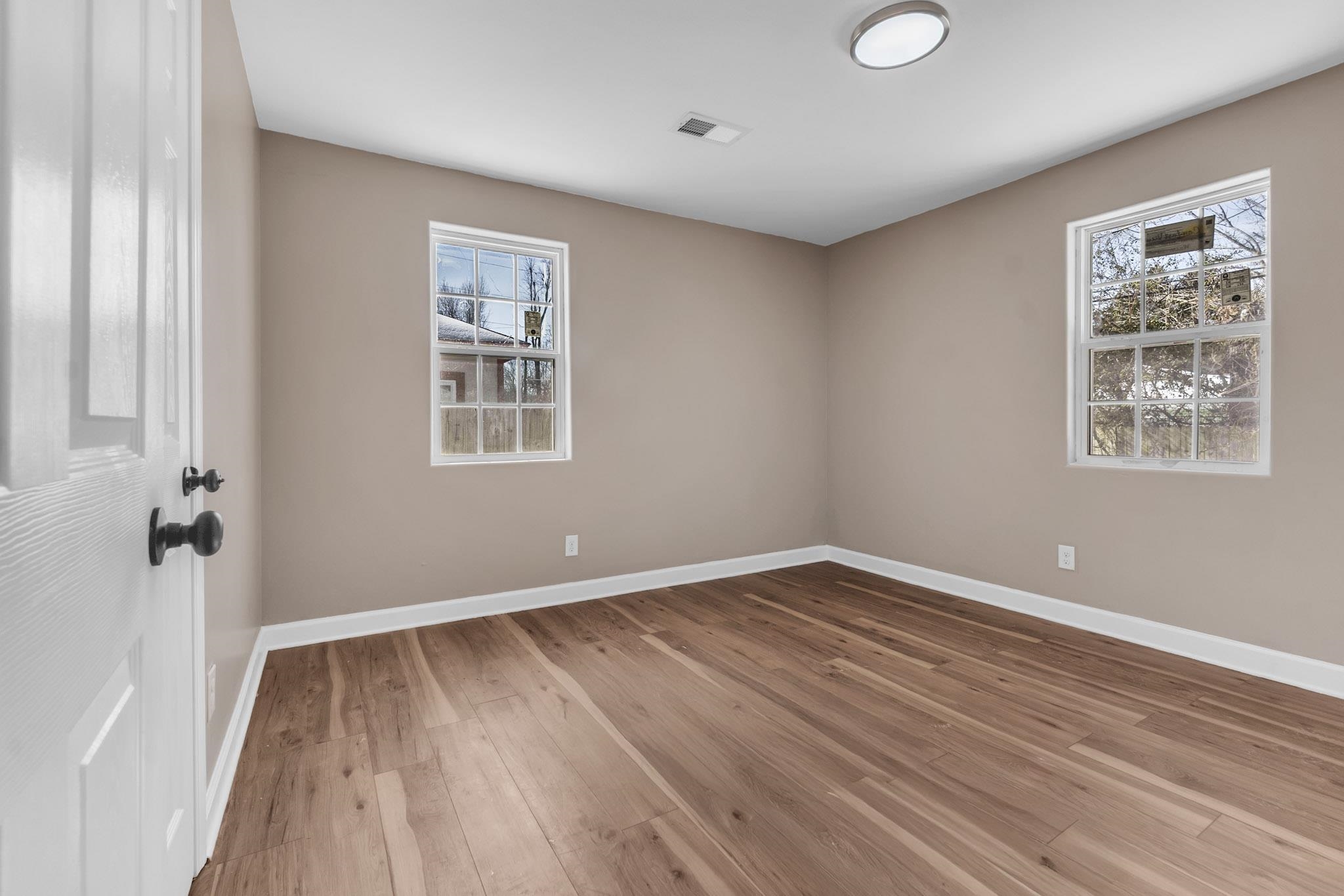 375 Pope Street Memphis, TN 38112 - Photo 8 of 19 Spare room with light wood-style floors and baseboards