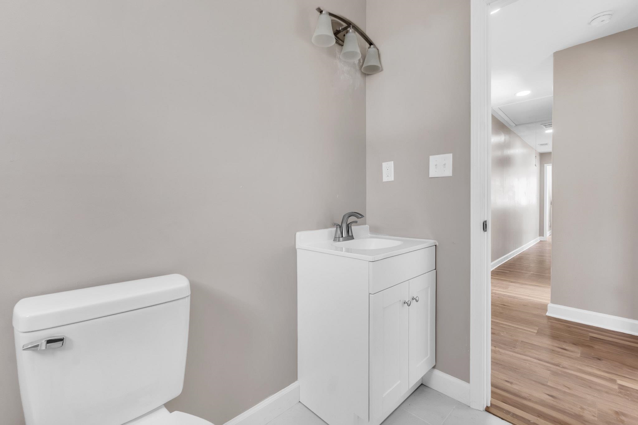 375 Pope Street Memphis, TN 38112 - Photo 10 of 19 Half bath with vanity and baseboards