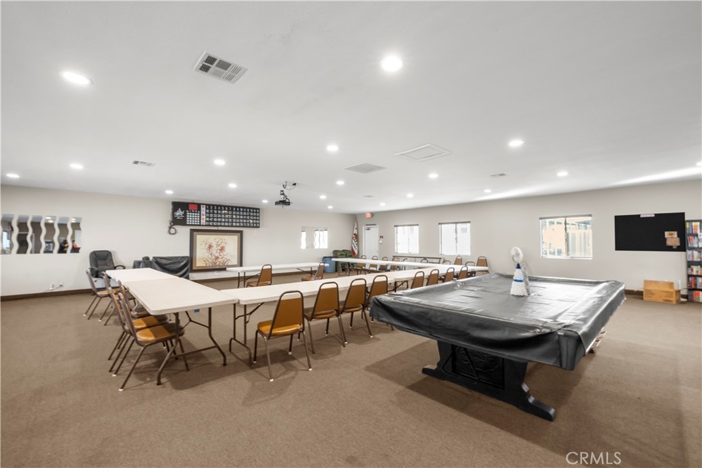 27150 Shadel Road, Unit 122 Menifee, CA 92586 - Photo 20 of 26 a kitchen with a table and chairs in it