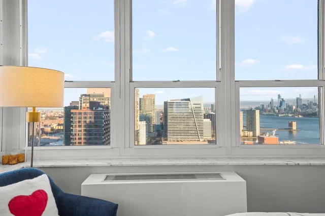 a view of a patio with couches and a table and chairs