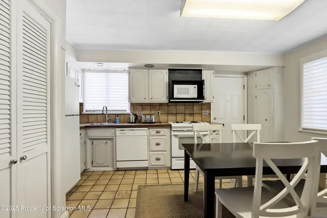 a spacious bedroom with a bed and a couch