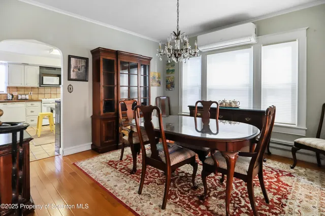 a bedroom with two beds and a dresser