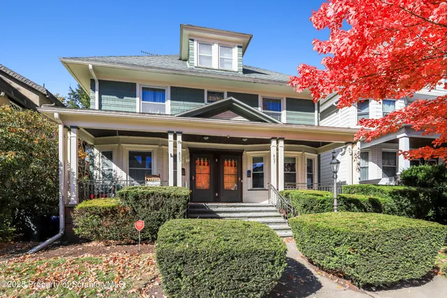 front view of a house with a small yard