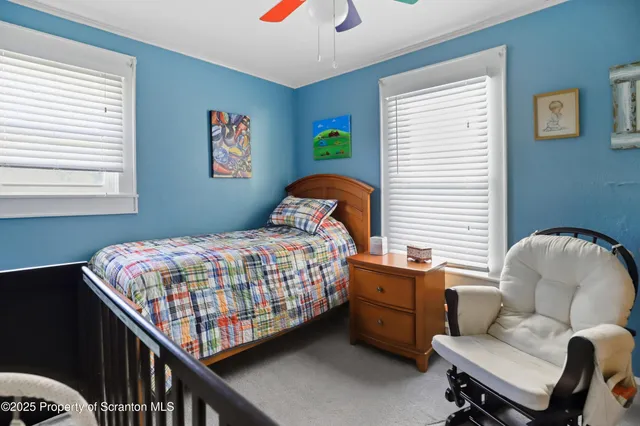 a view of an empty room with a flat screen tv