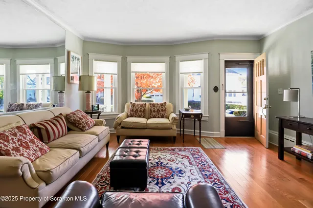 a view of a livingroom with furniture and a window