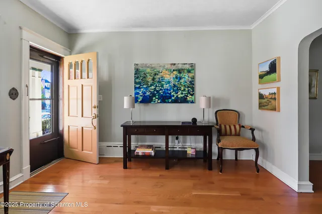 a room with furniture piano and wooden floor