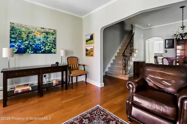 a kitchen with a table chairs sink and cabinets