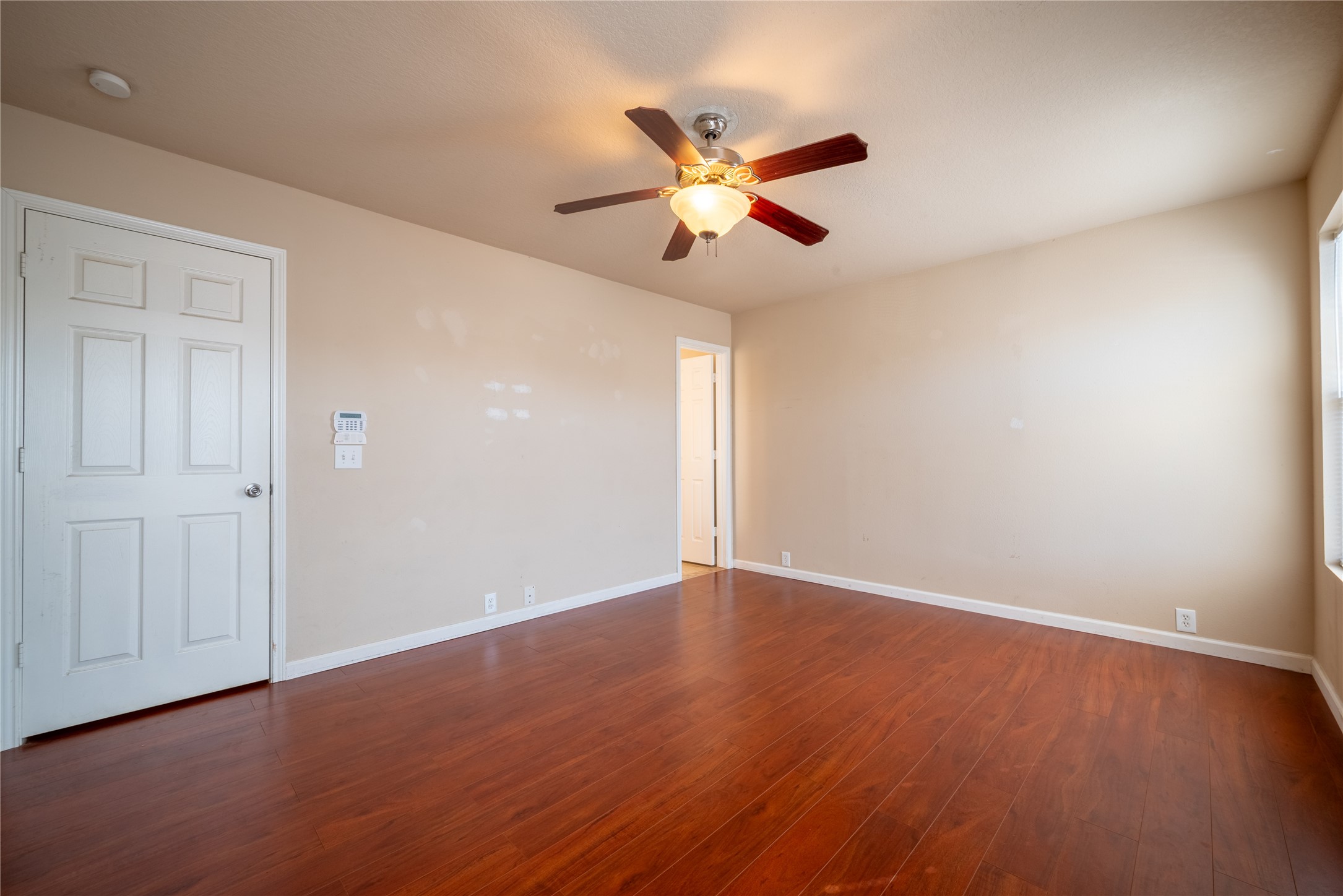 23823 Pebworth Place Spring, TX 77373 - Photo 13 of 31 a view of an empty room with wooden floor