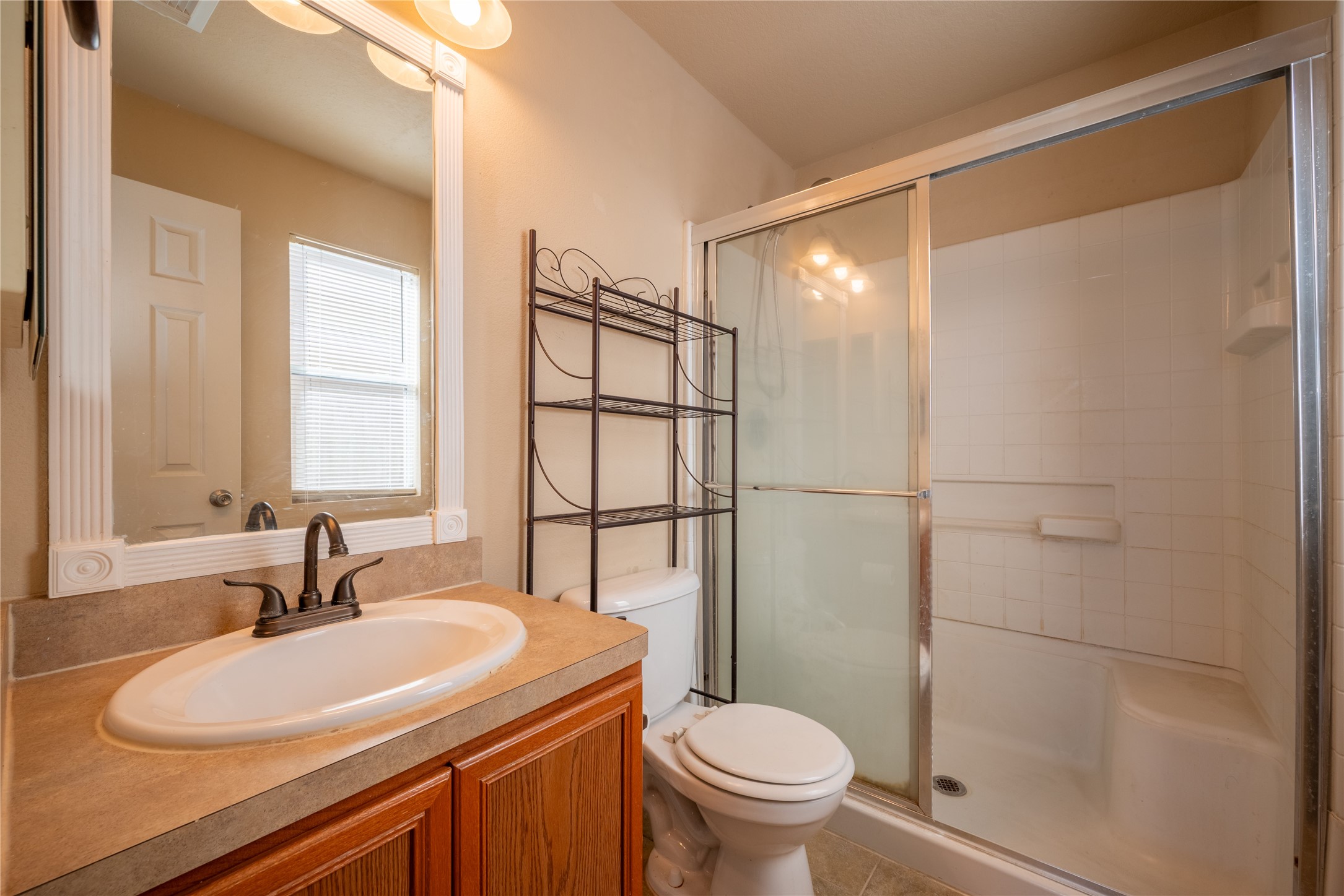 23823 Pebworth Place Spring, TX 77373 - Photo 14 of 31 a bathroom with a sink toilet and shower