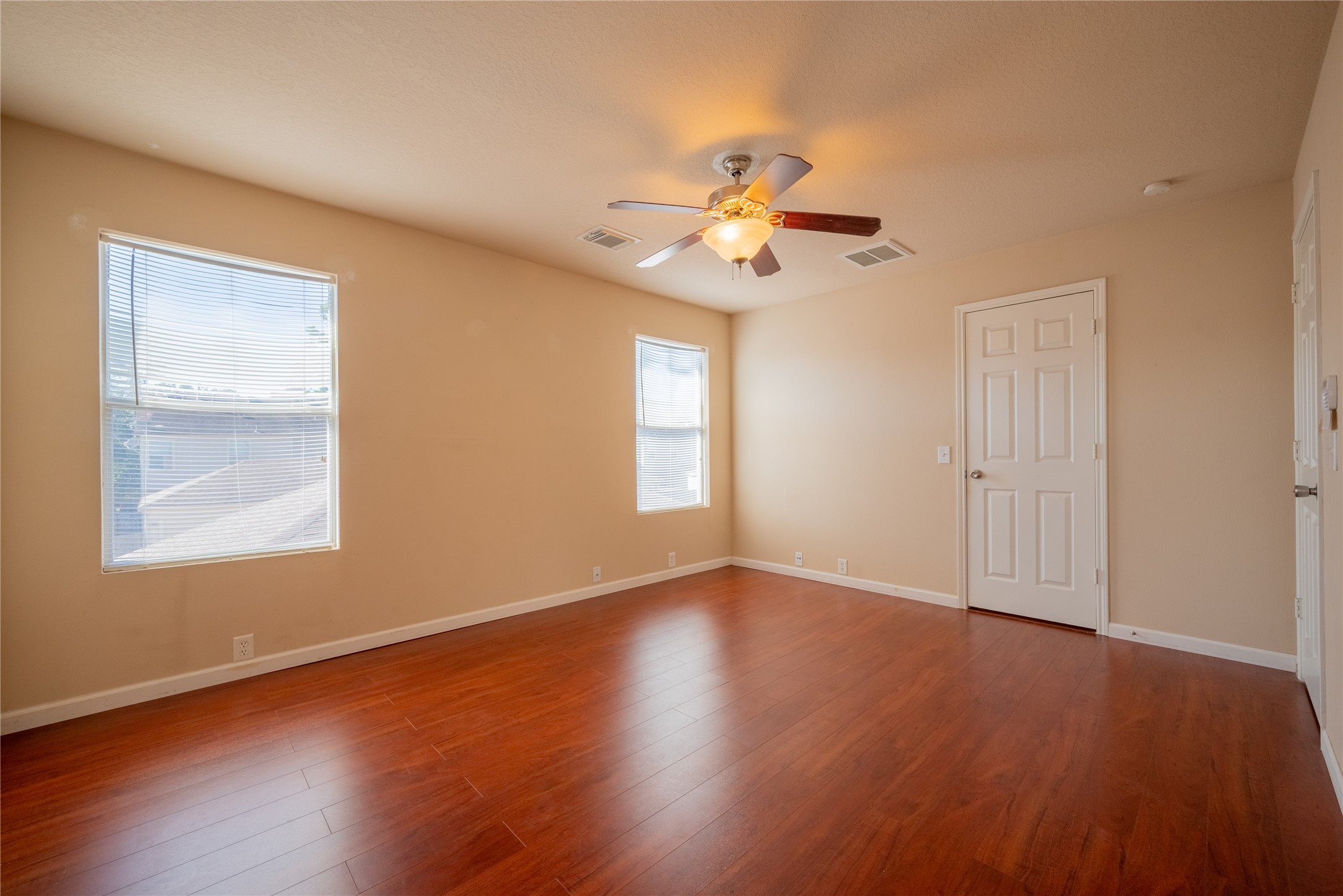 23823 Pebworth Place Spring, TX 77373 - Photo 15 of 31 a view of an empty room with a window and wooden floor
