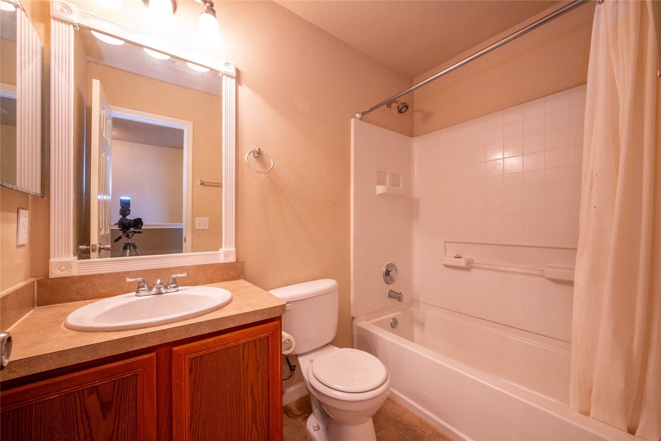 23823 Pebworth Place Spring, TX 77373 - Photo 17 of 31 a bathroom with a granite countertop sink toilet mirror and shower