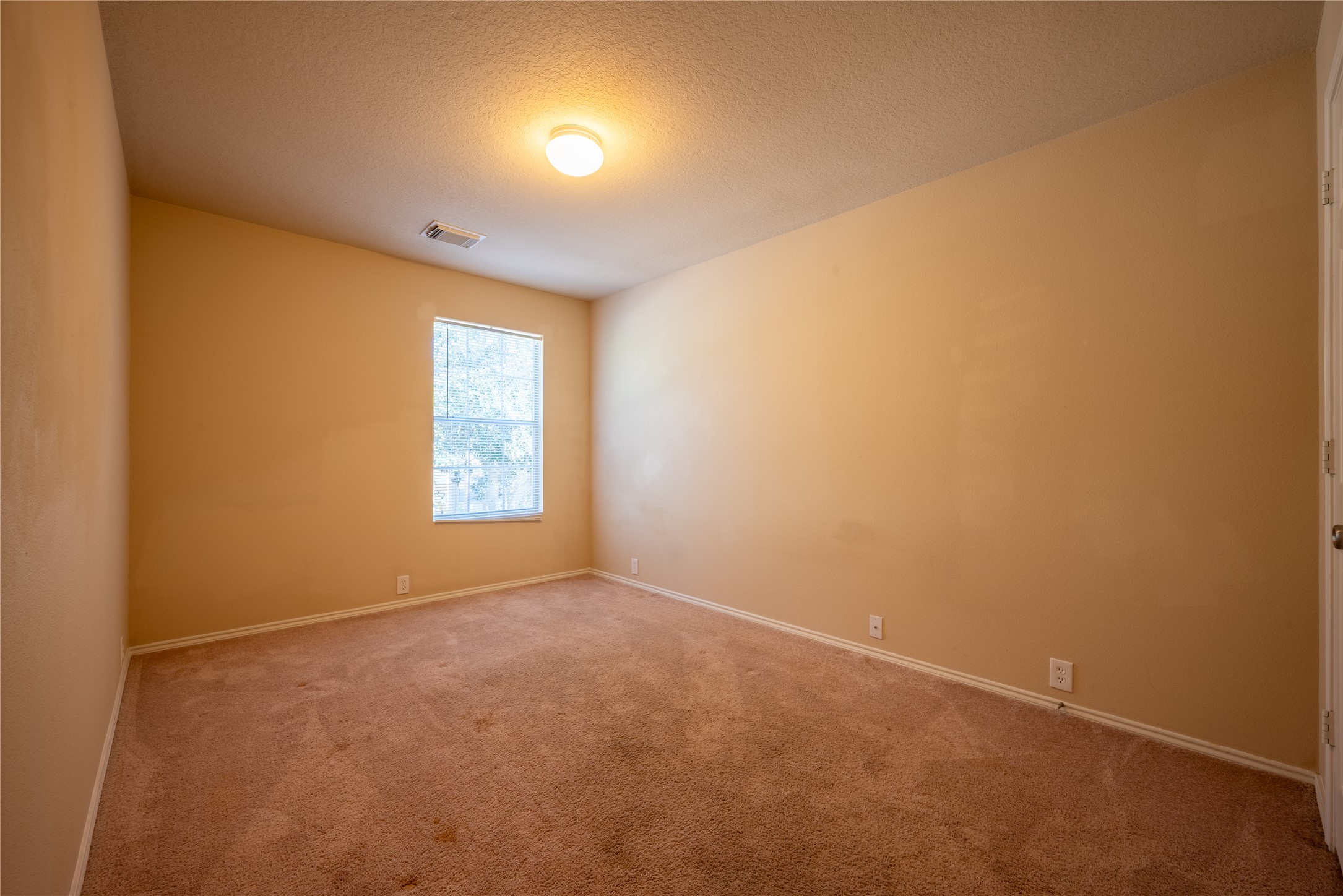 23823 Pebworth Place Spring, TX 77373 - Photo 22 of 31 a view of an empty room with a window