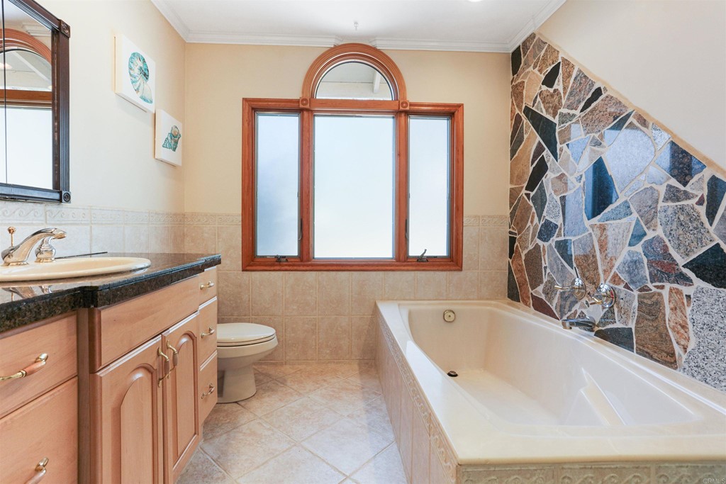 1188 Crystal Lane El Cajon, CA 92020 - Photo 15 of 26 a bathroom with a sink a toilet and a bathtub