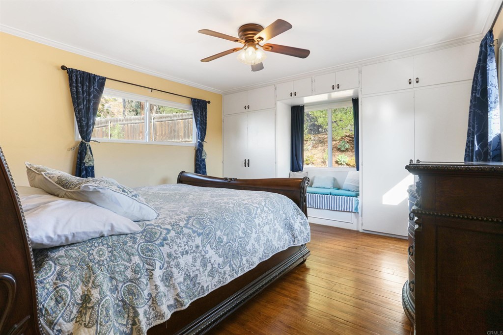 1188 Crystal Lane El Cajon, CA 92020 - Photo 16 of 26 a bedroom with a bed and wooden floor